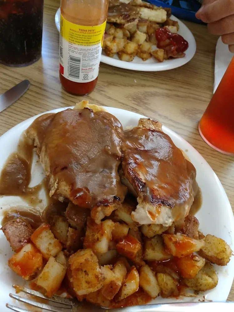 Open Faced Tenderloin on Biscuit with Gravy and Home Fries